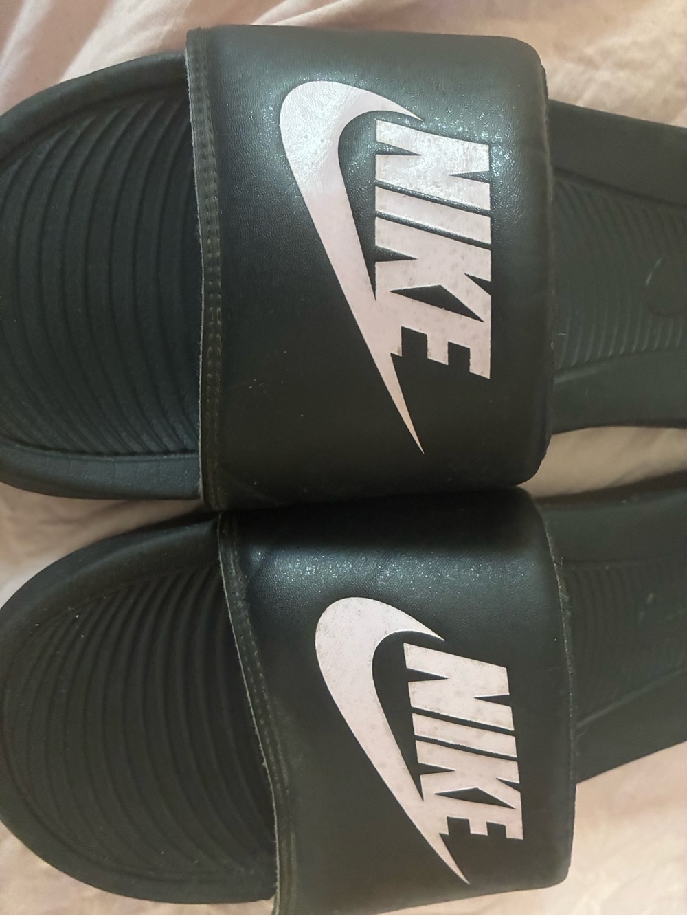 Nike Black Slides with White Swoosh Logos